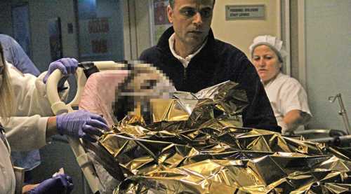 Tartıştığı eşini benzin döküp yaktı