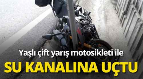 Yaşlı çift yarış motosikleti ile kanala uçtu